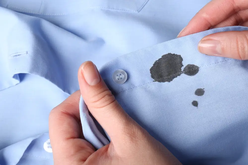 dark red stain on blue shirt